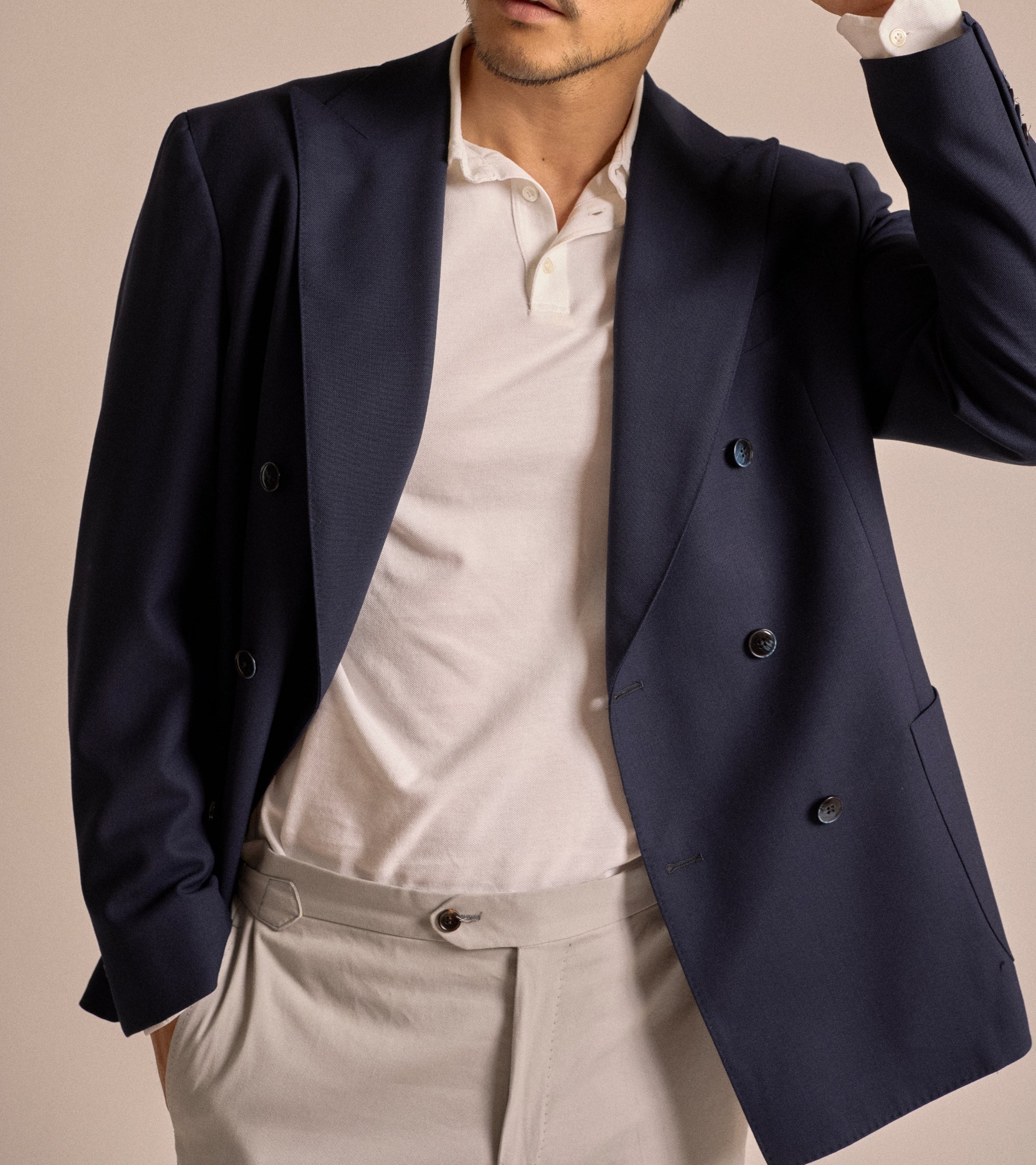 Trunk Webb double breasted jacket in navy tropical wool, styled shot.