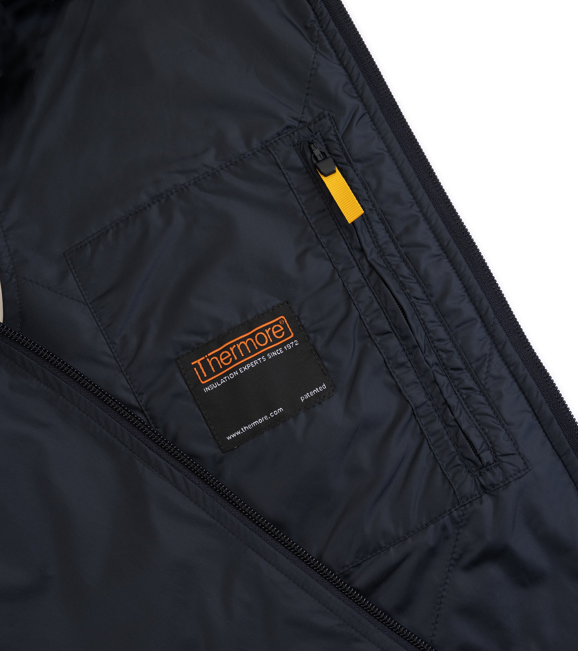 Aspesi Vernes gilet in navy nylon, close-up detail of the lining and inside zip pocket with yellow pull tab.