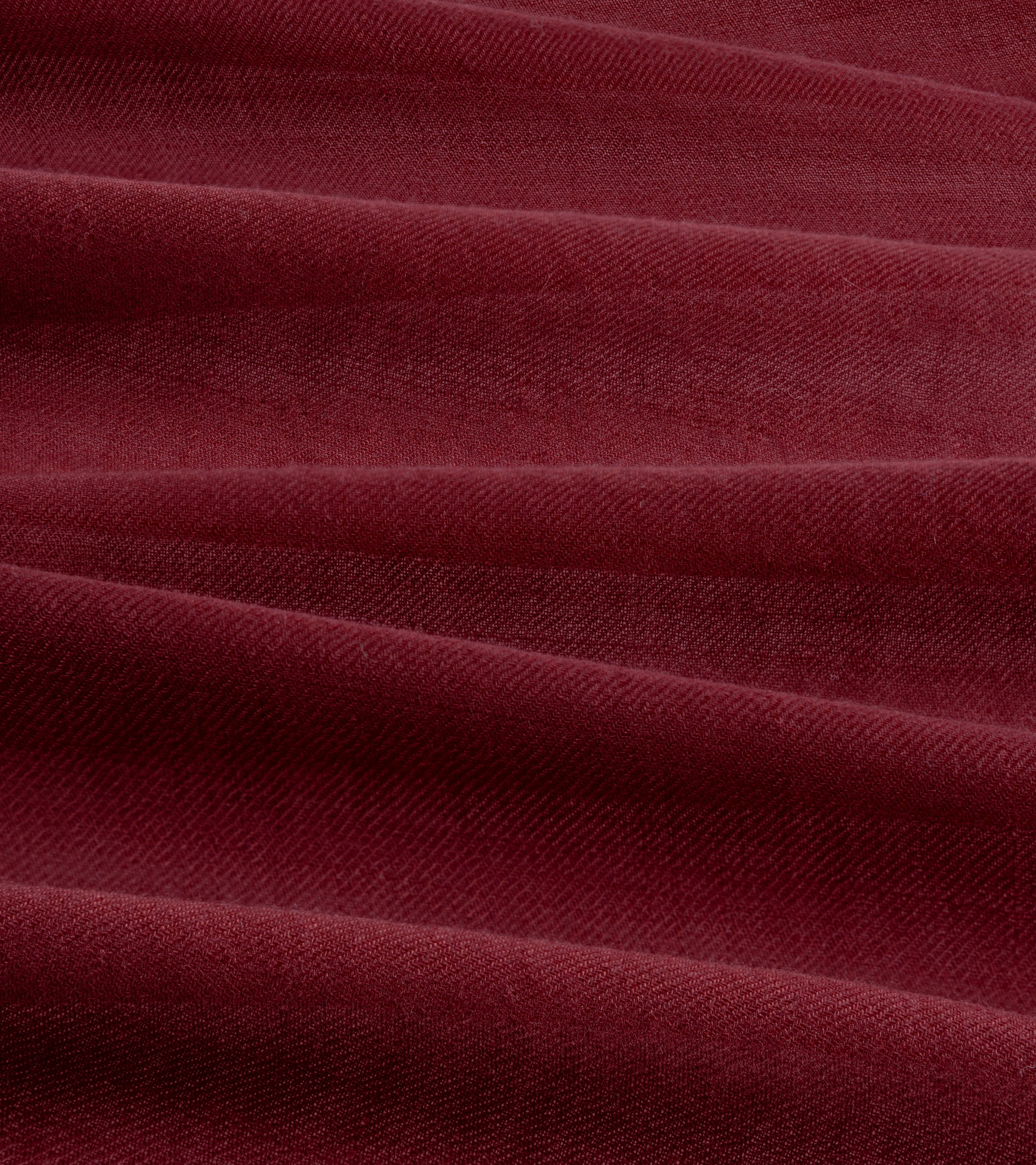 A close-up of the burgundy fabric with a soft, slightly textured weave.