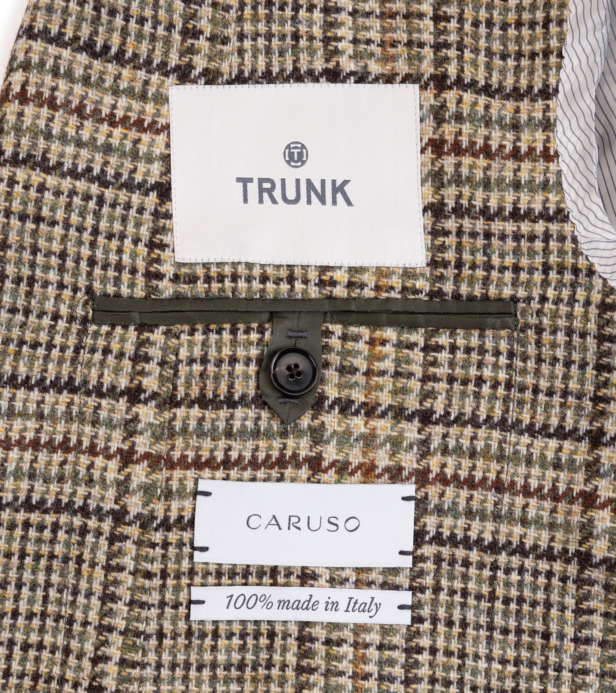 Caruso Aida Wool Large Glencheck Jacket in brown/green. Close-up detail of the inner pocket with button closure and labels.