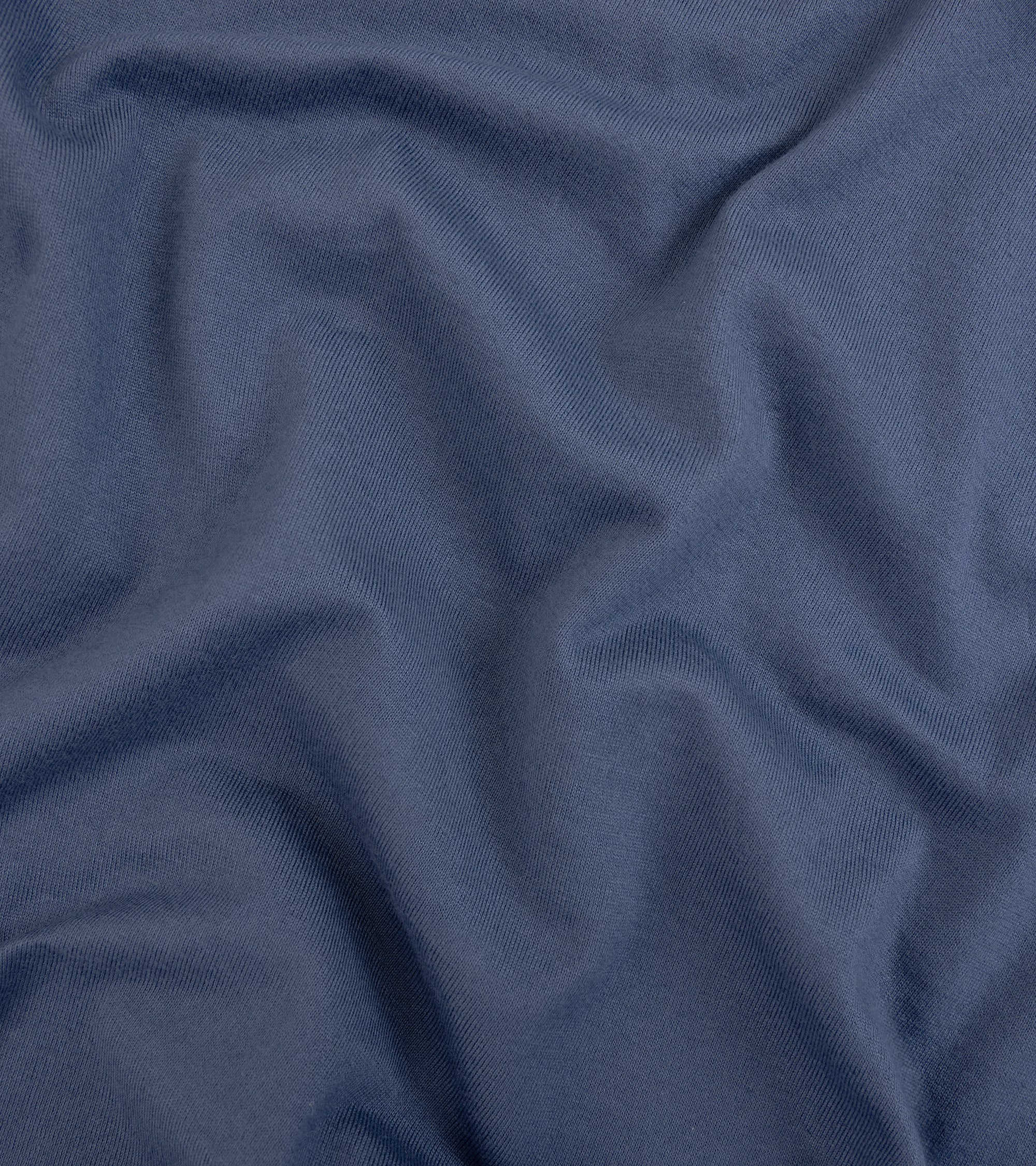 Fedeli Zero Cotton Jersey Long Sleeve Polo Shirt in dark blue. Close-up detail of the organic cotton fabric.