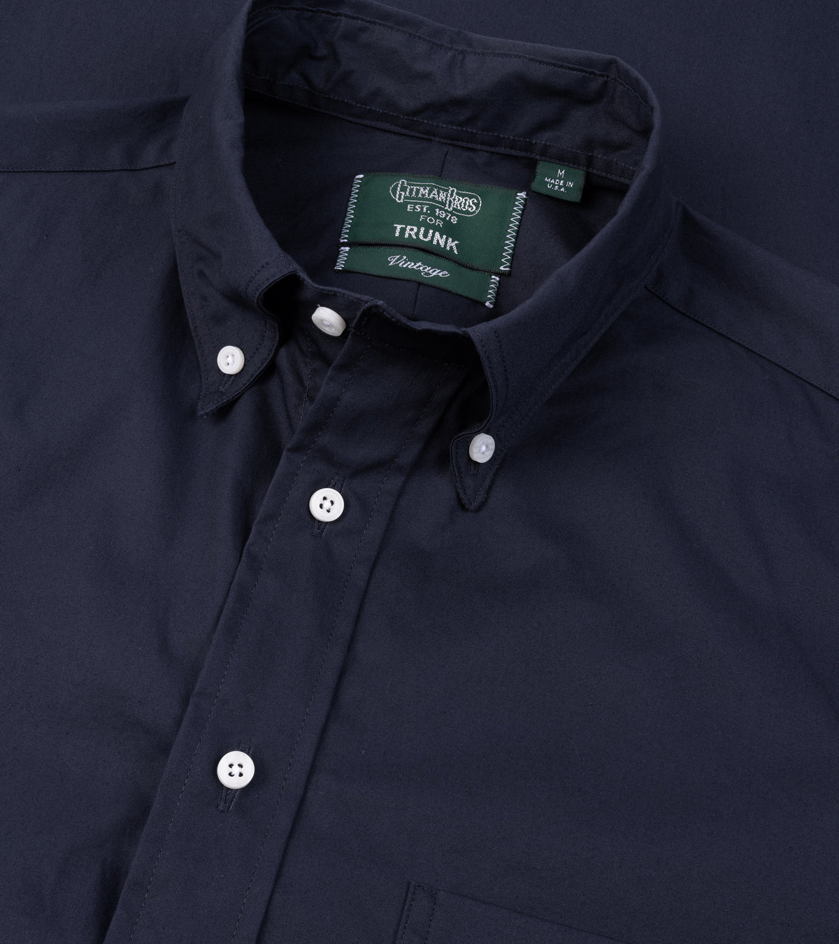 A close-up of the Gitman Vintage Japanese Cotton Twill Button Down Shirt in Navy showing the collar and mother of pearl buttons.
