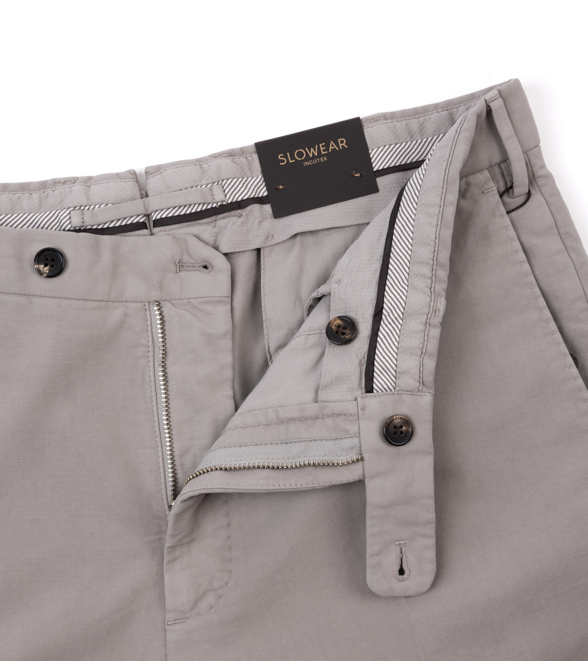 Close-up of the Incotex Regular High Cotton Doeskin Trousers in Greige showing the waistband, zipper and button details.