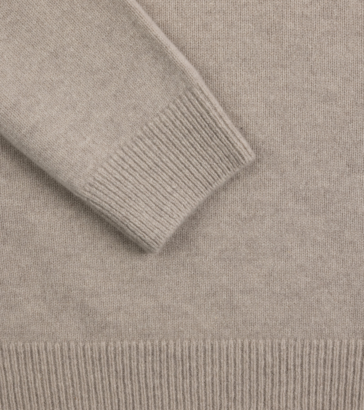 Close up of the Mooncastle Wool Cashmere Silk Crew Neck Sweater in Beige Grey showing the ribbed cuff and hem details.