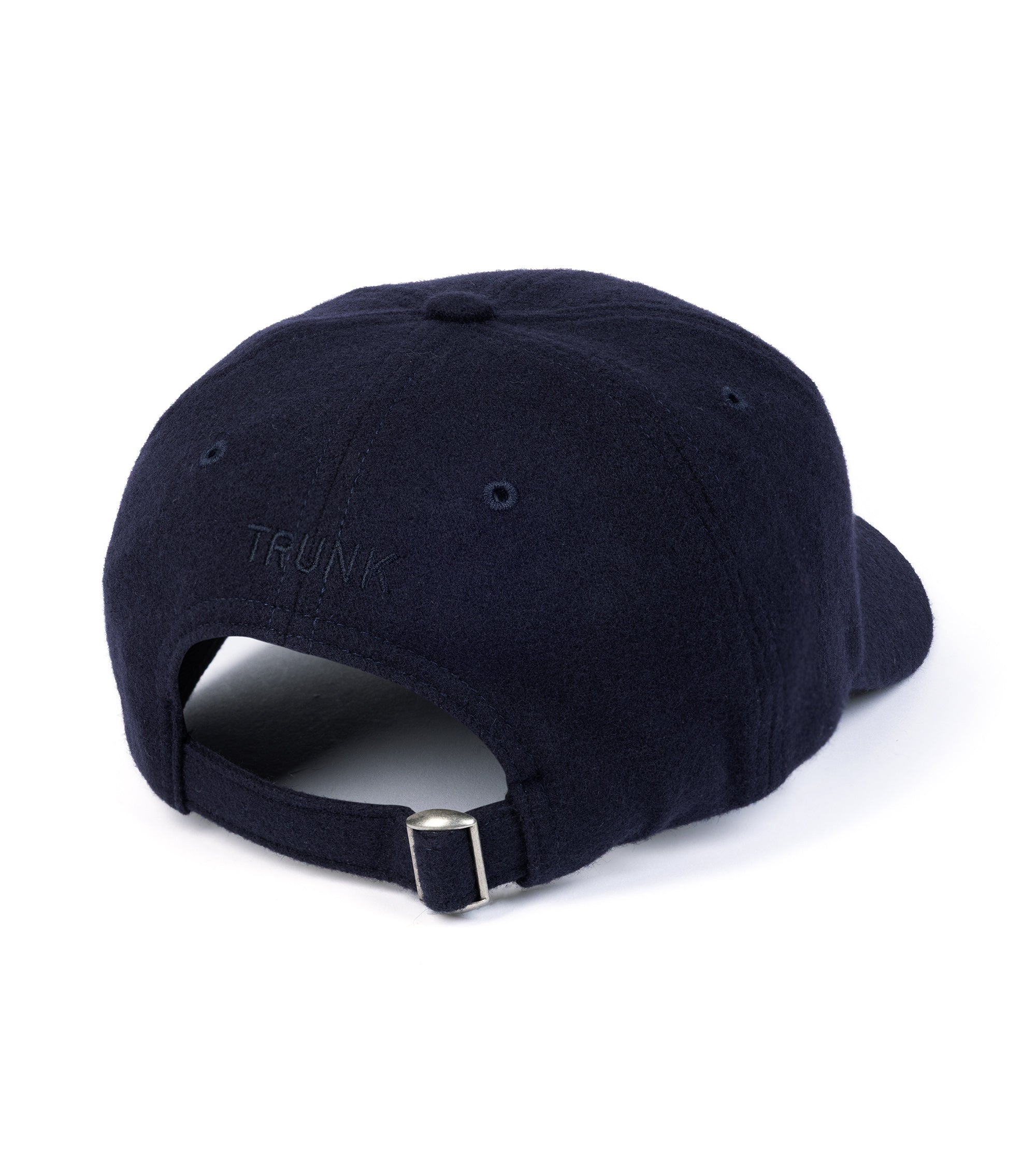 Trunk Wool Flannel Baseball cap in navy, back view. Detailed view of adjustable strap and tonal Trunk branding embroidery.