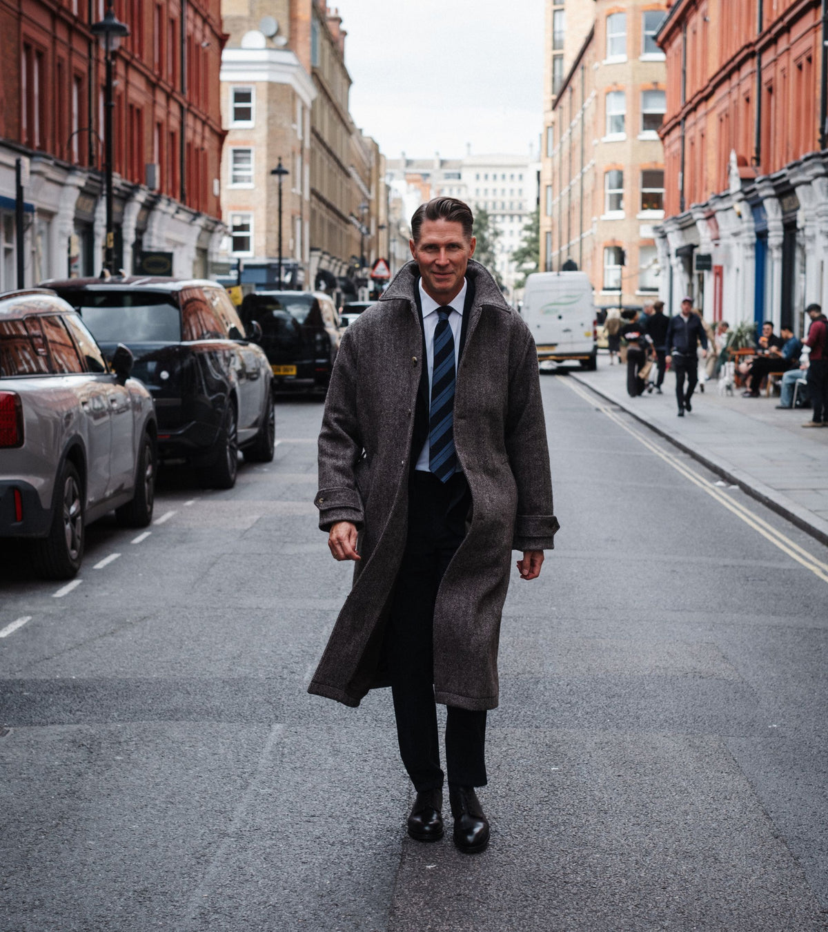 De Bonne Facture Herringbone Wool Overcoat in undyed brown, product photo.