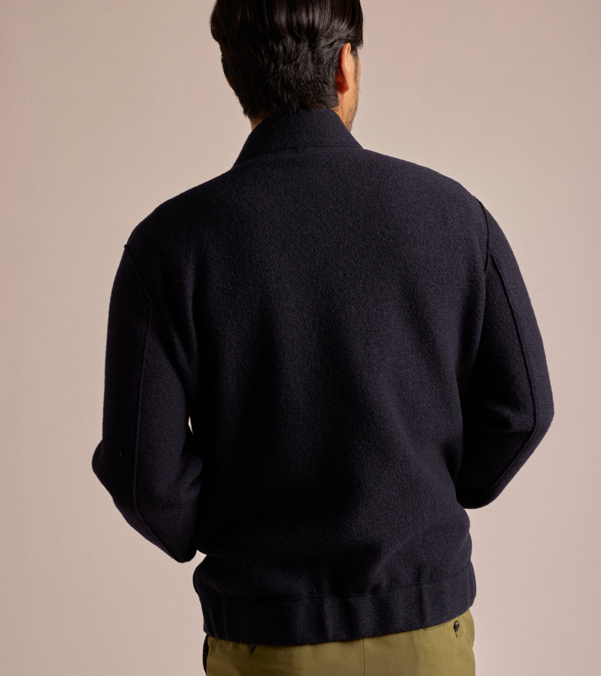 Model wearing the Harris Wharf Boiled Wool Bomber Jacket in Navy Blue shown from the back.
