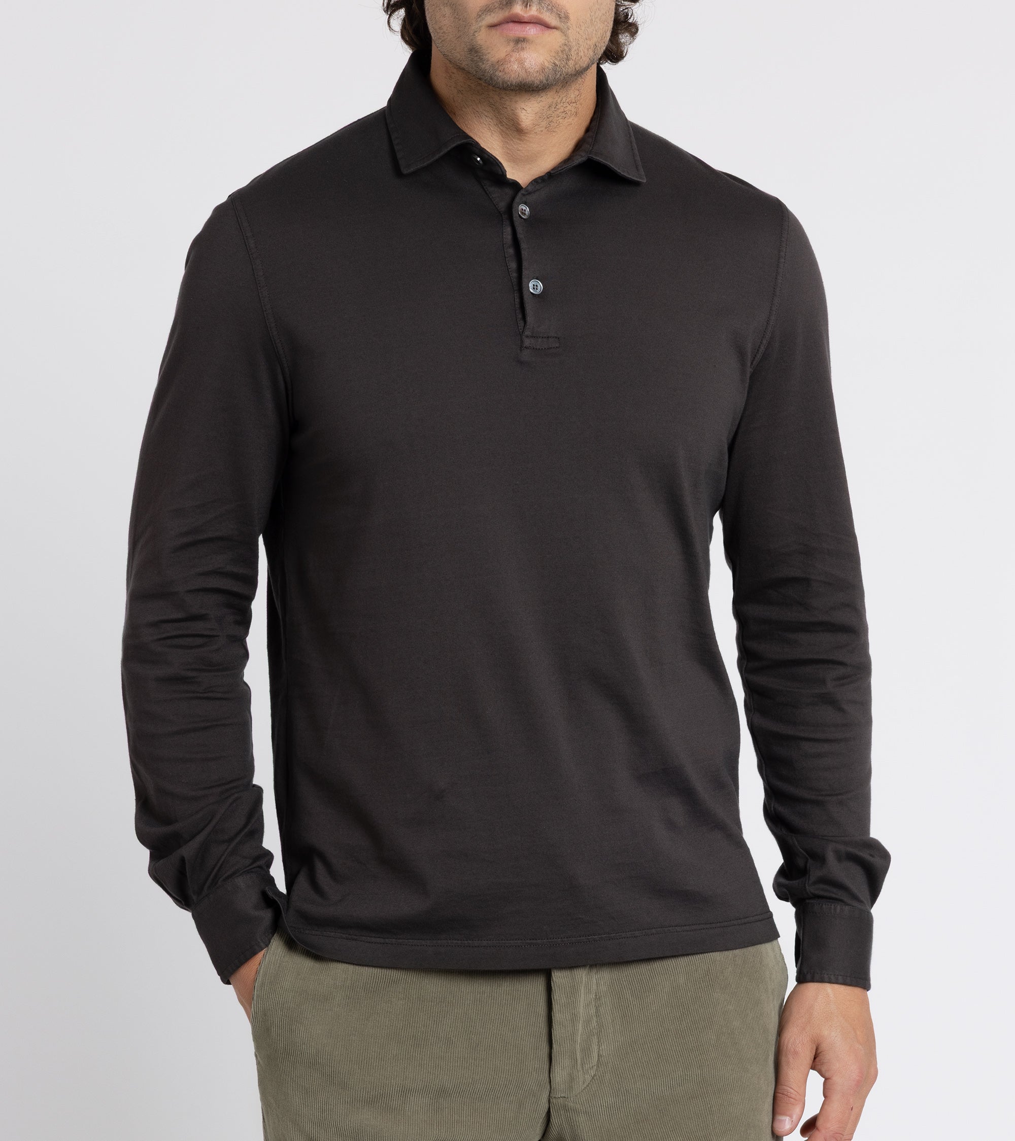 Model wearing the Fedeli Zero Cotton Jersey Long Sleeve Polo Shirt. Front view with the top button undone.