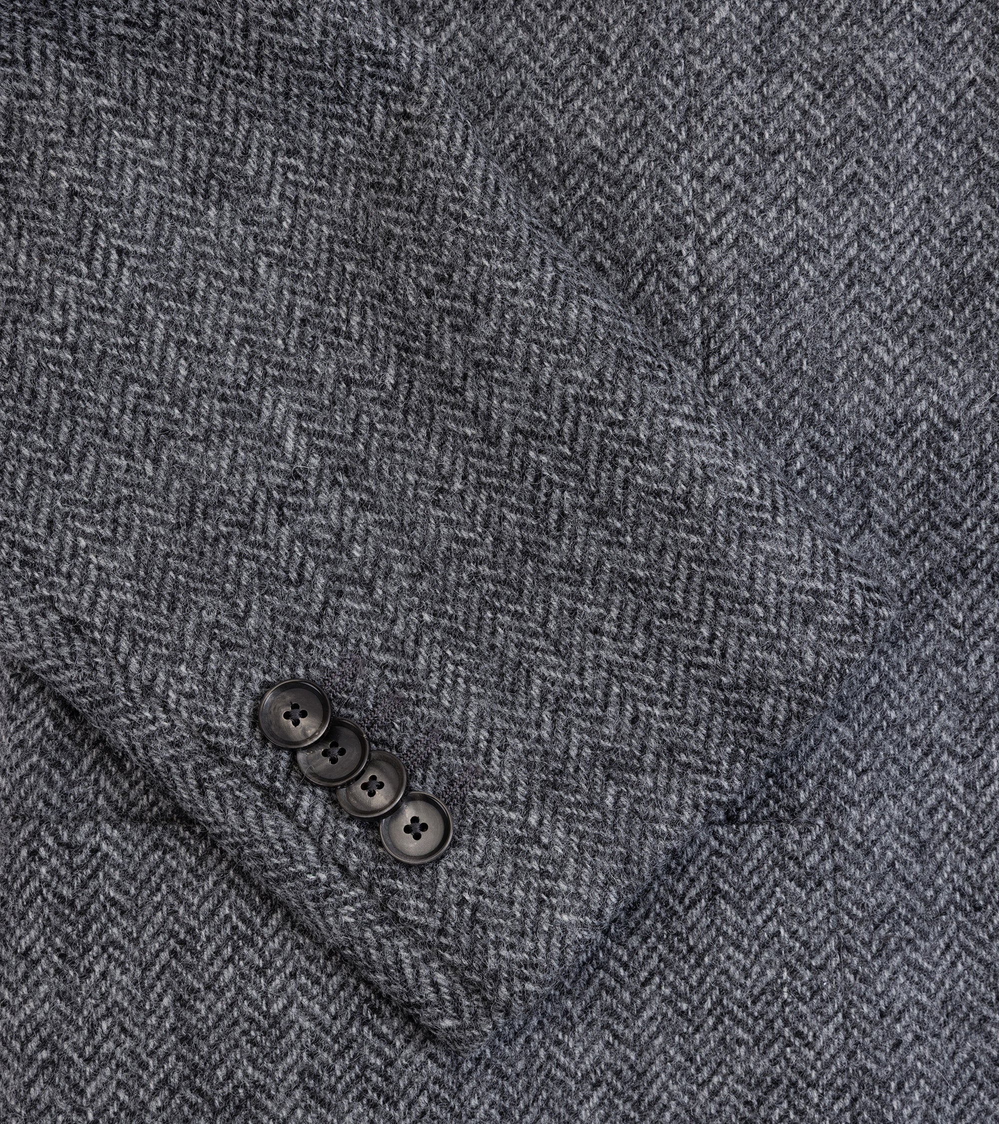 Caruso Aida jacket in grey Shetland wool herringbone, cuff detail and detail of the fabric.