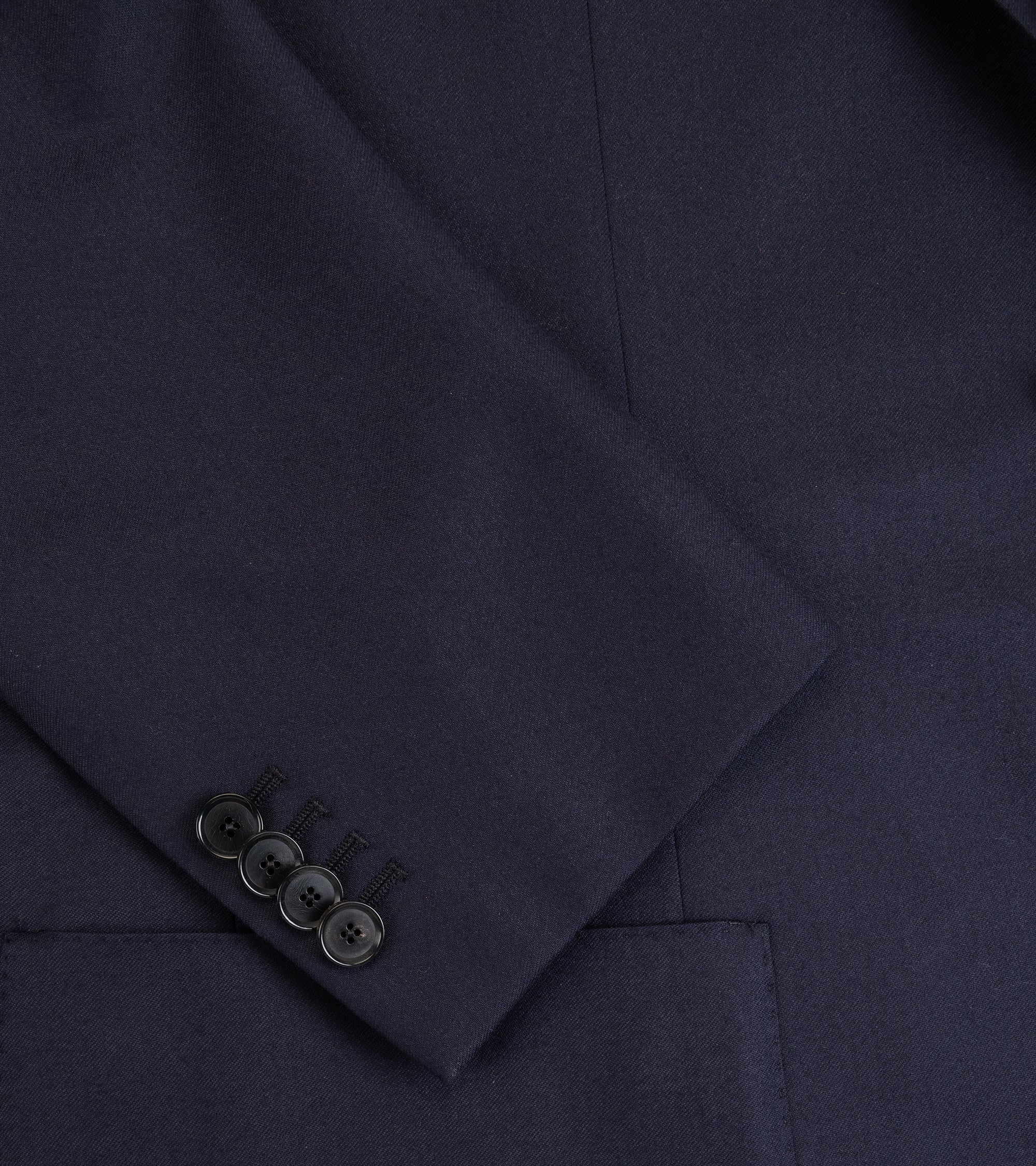 Caruso superlight wool flannel suit in navy, close-up of the sleeve and cuff with four buttons.