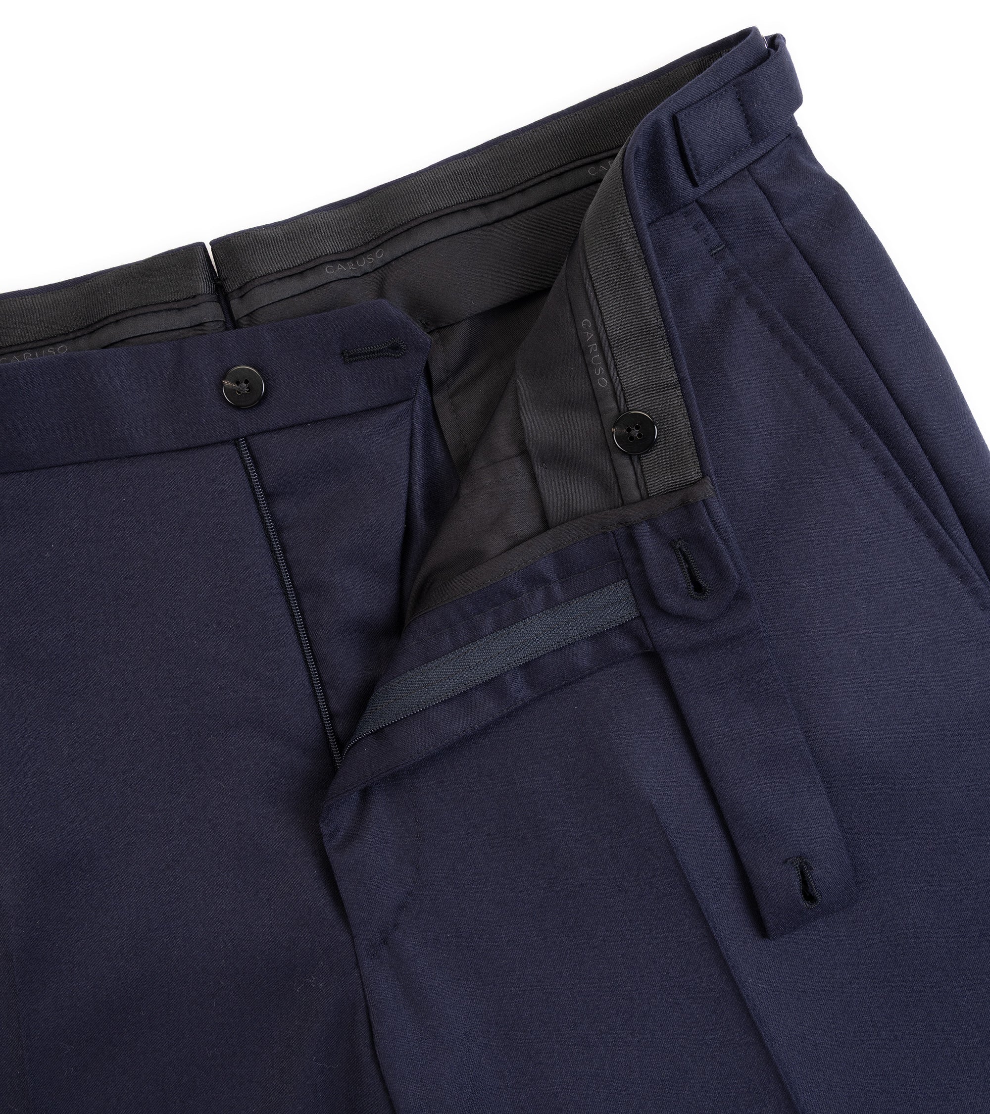 Caruso superlight wool flannel suit jacket in navy,  close-up details of the trousers showing the zip fly and button closure.