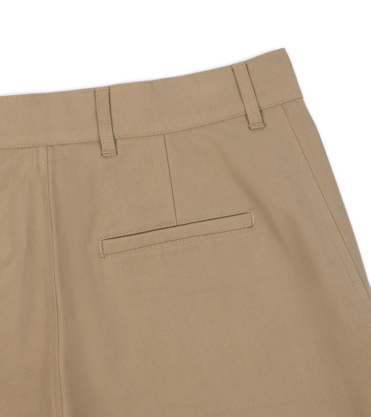 Close-up of the De Bonne Facture Soft Cotton Balloon Trousers in Bronze, showing the back waistband, belt loops and a welt pocket.