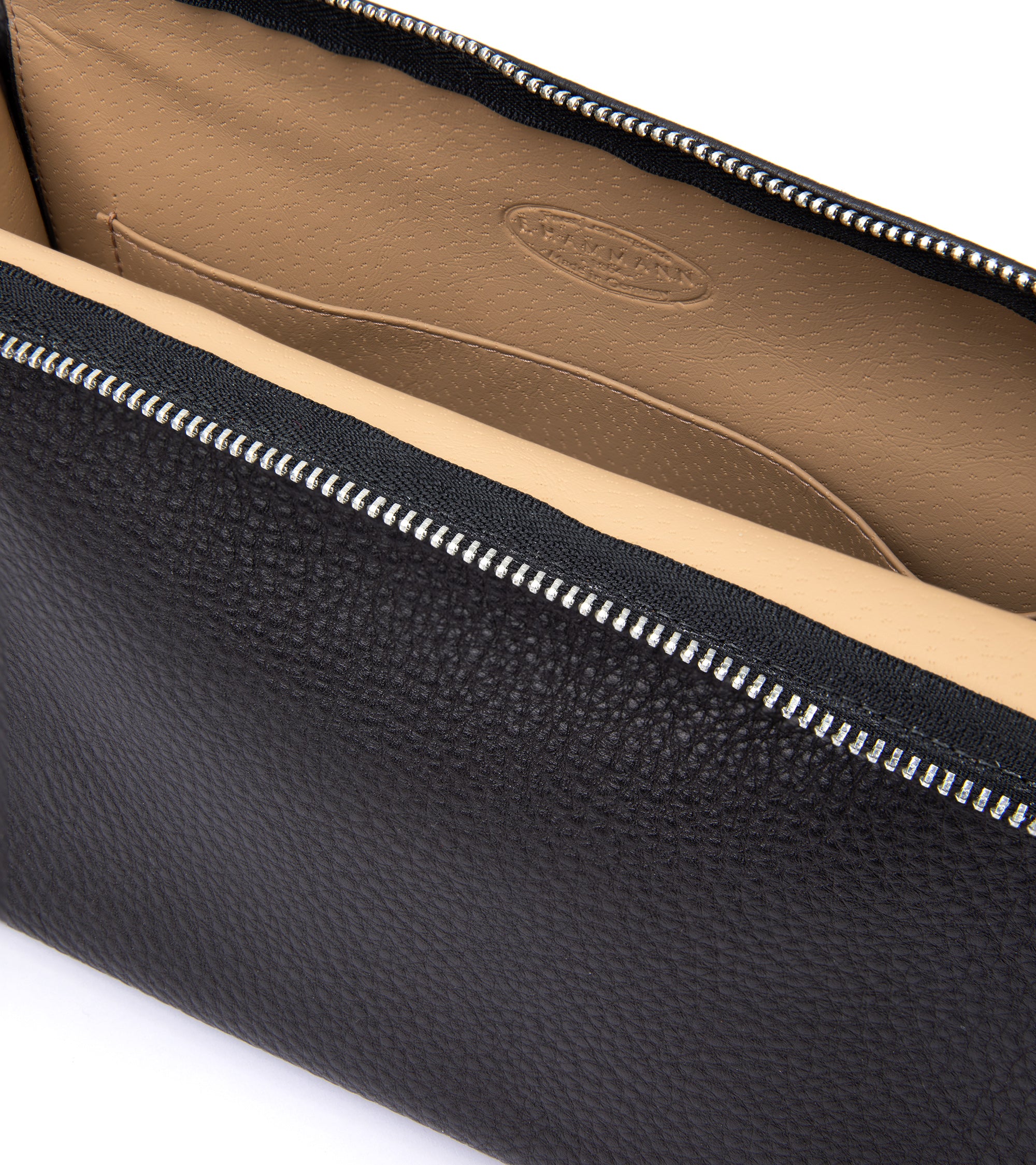 F. Hammann leather wash bag in brown, close-up of the zip and handle.