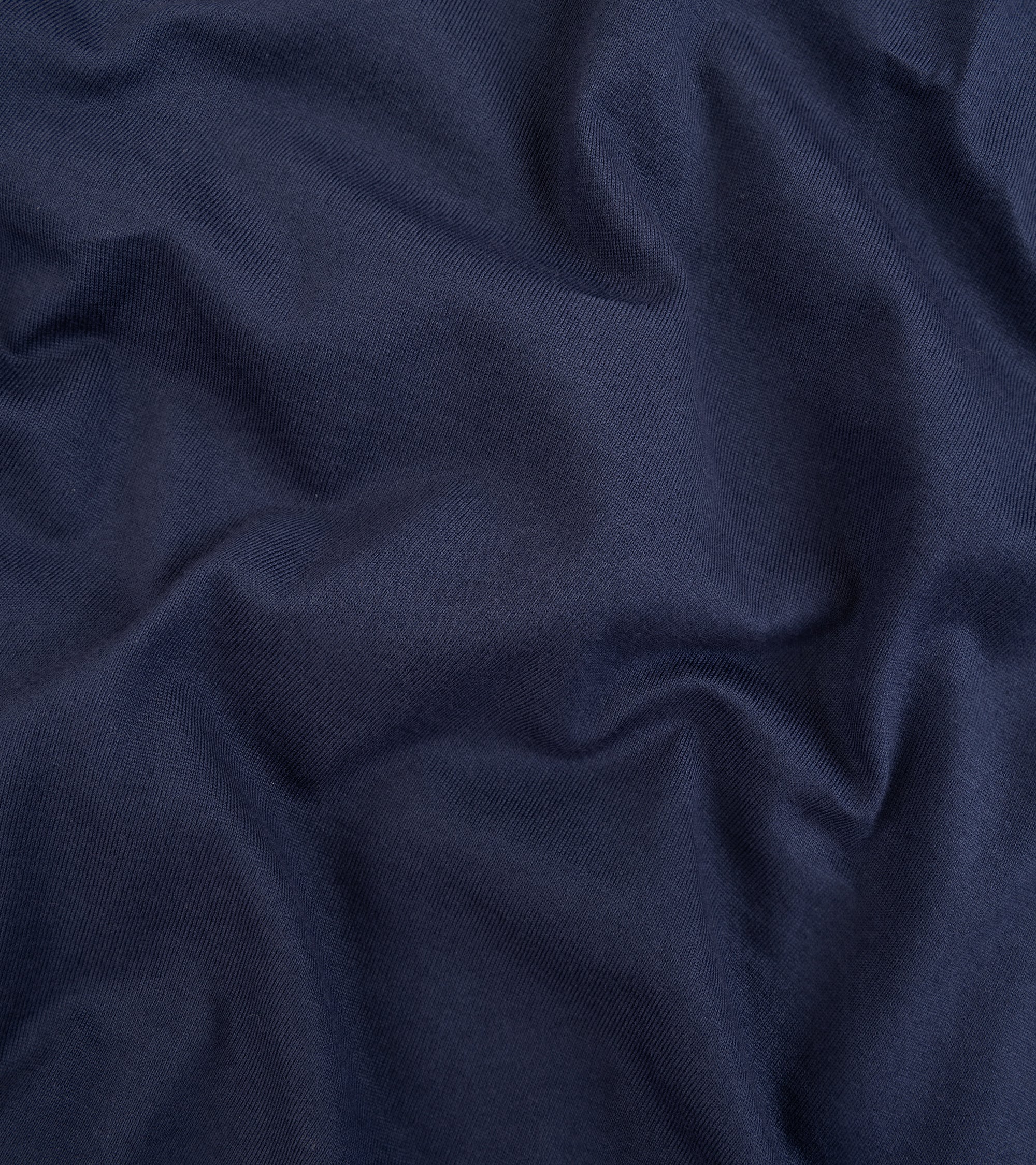 Fedeli Zero Cotton Jersey Long Sleeve Polo Shirt in Midnight Blue. Close-up detail of the organic cotton fabric.