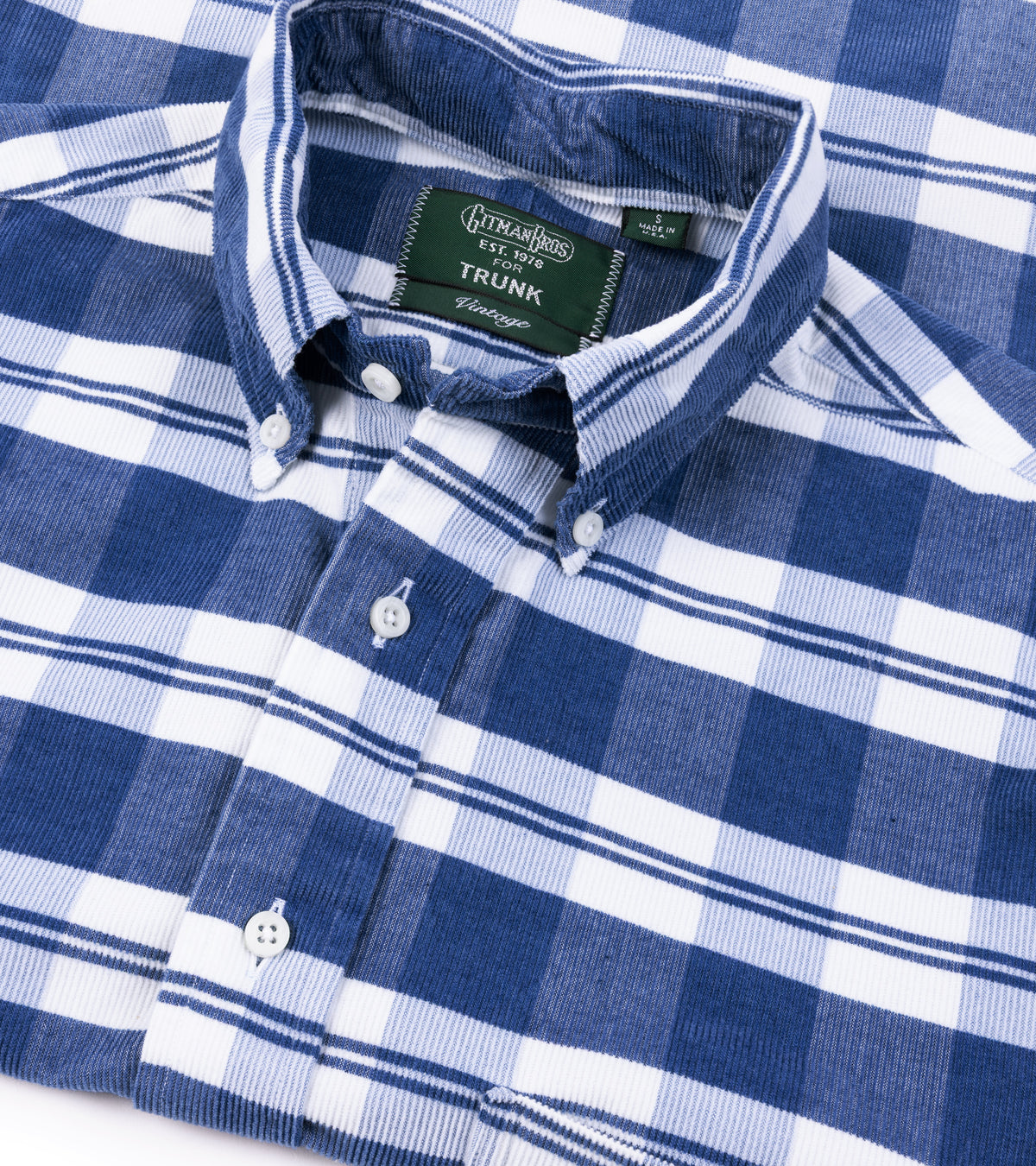 A close-up of the Gitman Vintage Fine Cord Check Button Down Shirt in Indigo showing the collar, front buttons, and fabric texture.