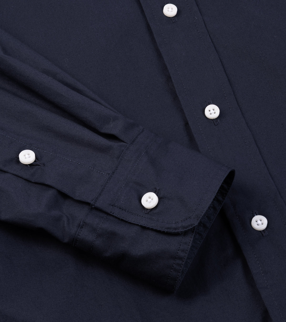 Close-up of the Gitman Vintage Japanese Cotton Twill Button Down Shirt in Navy showing the buttoned cuff and fabric texture.