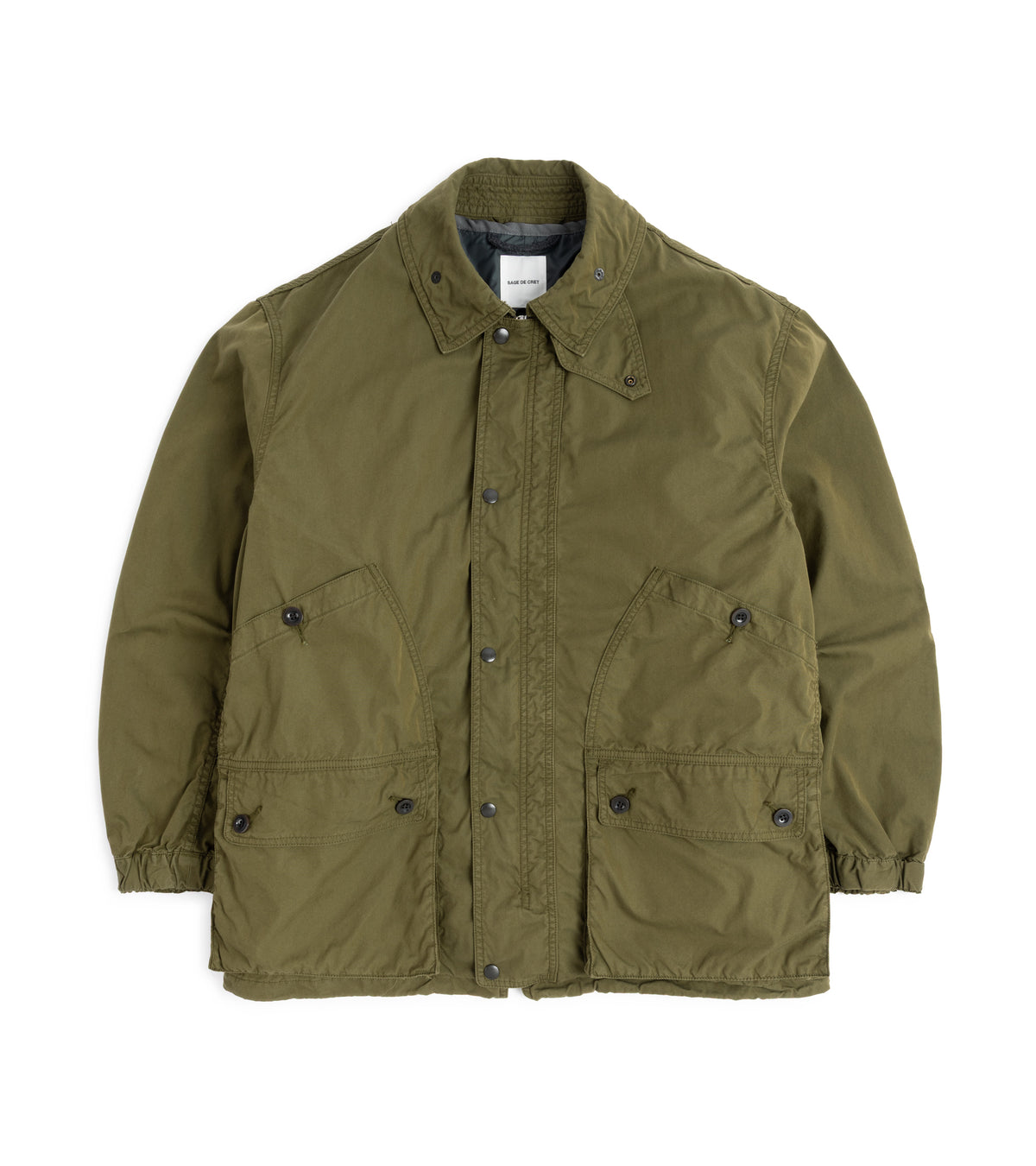 Sage de Cret Cotton Nylon Oxford Three-Way Work Jacket in Olive, front view. The jacket features a spread collar with snap storm tab. Metal snap-button closure with a concealed zip. Four front utility pockets with button fastening and elasticated cuffs on the sleeves. 