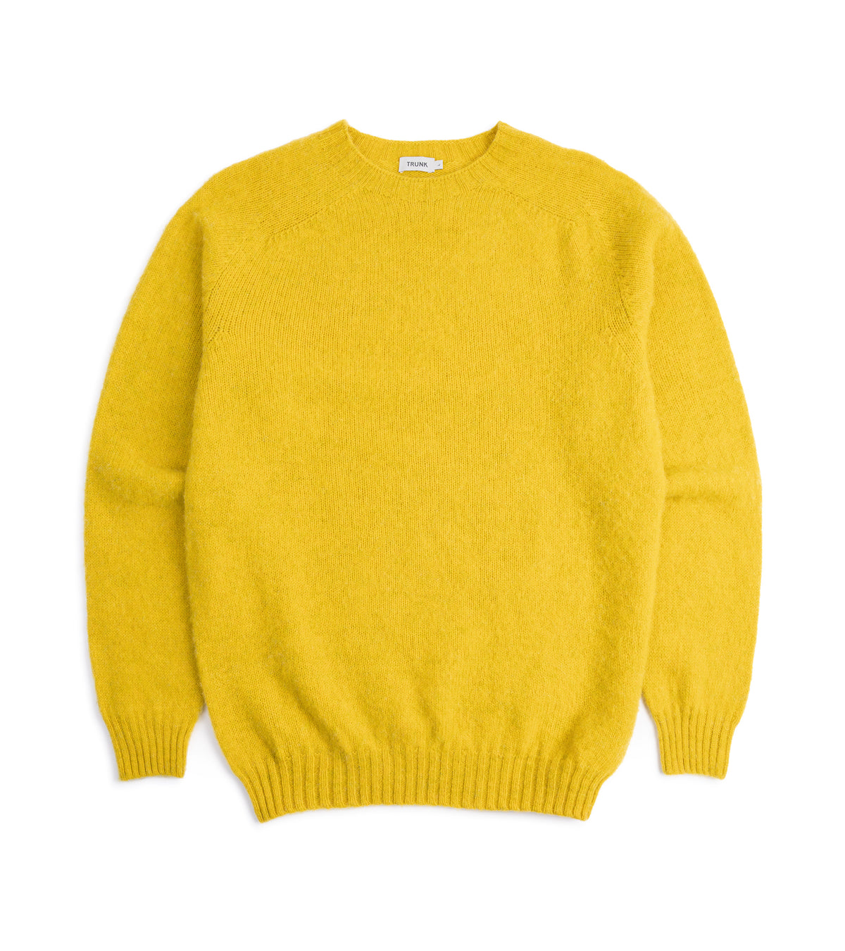 Trunk Goswell Brushed Lambswool Crew Neck Sweater in Citrus with ribbed cuffs and hem, front view.