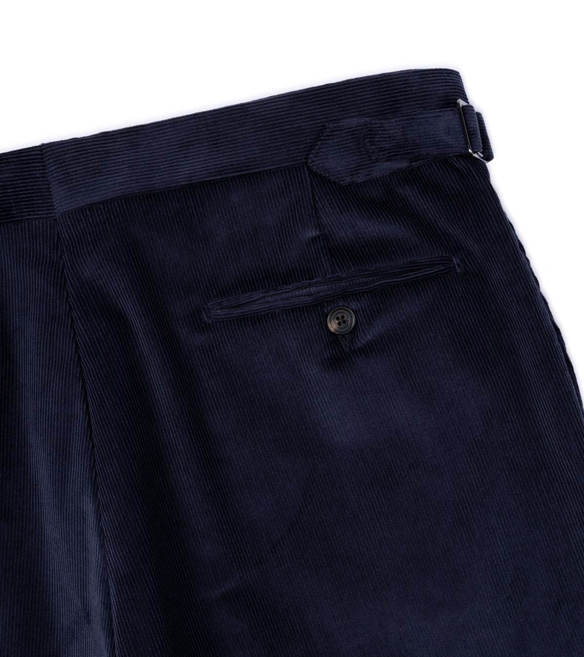 Trunk Hutton Cotton Corduroy Tailored Trousers in Navy, close-up detail of the back pocket and waist side adjuster.
