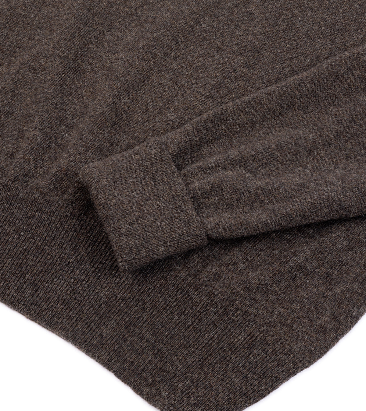 Close-up of the Trunk Walden Geelong Crew Neck Sweater in Brown with a folded cuff showing the ribbed texture.