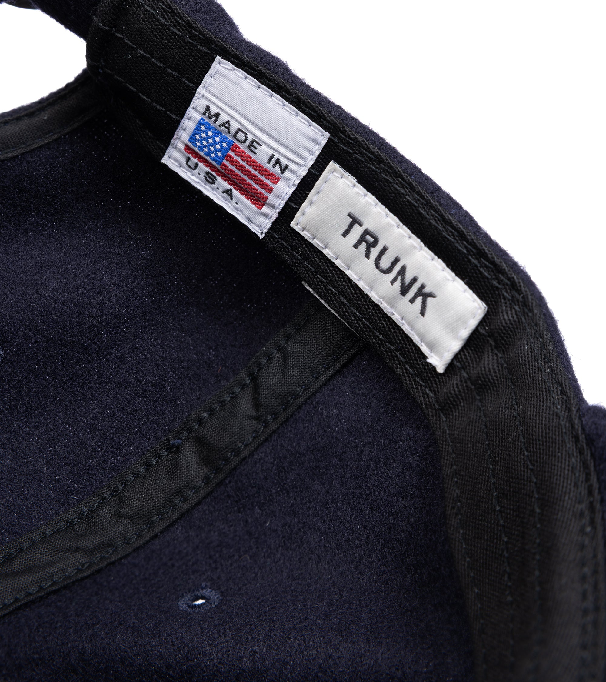 Trunk Wool Flannel Baseball cap in navy. Inside detail of the cap showing Trunk and Made in U.S.A. label.