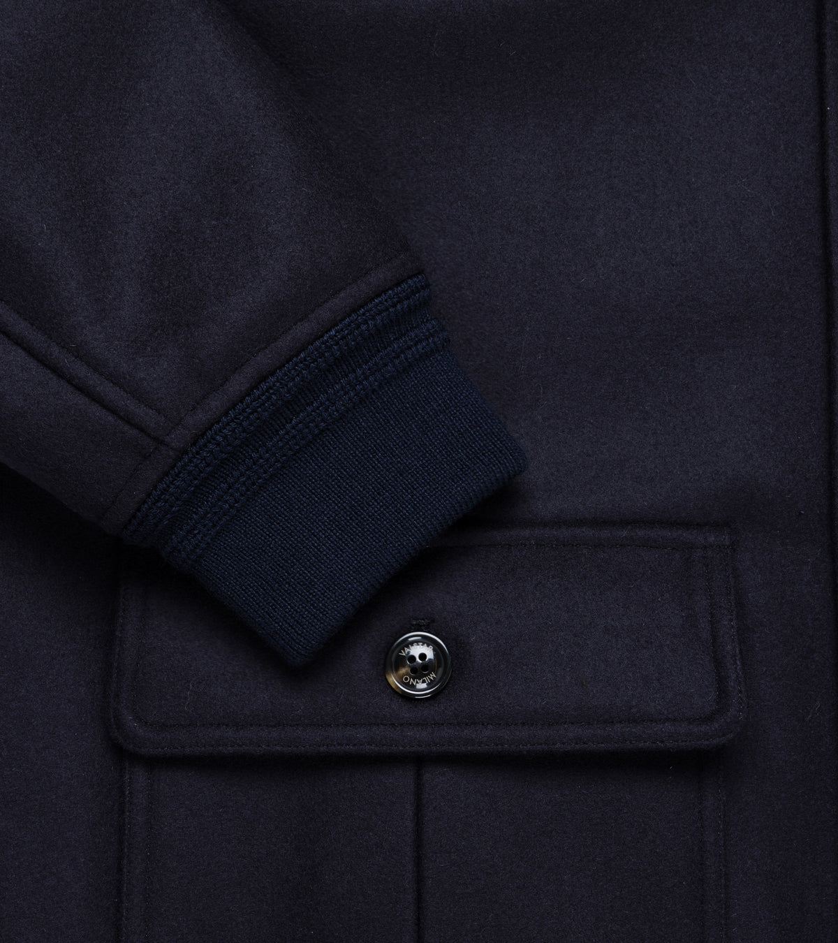 Valstar Valstarino Wool Felt Jacket in Navy. Lose-up detail of the ribbing on the cuff and pocket with Valstar button closure.