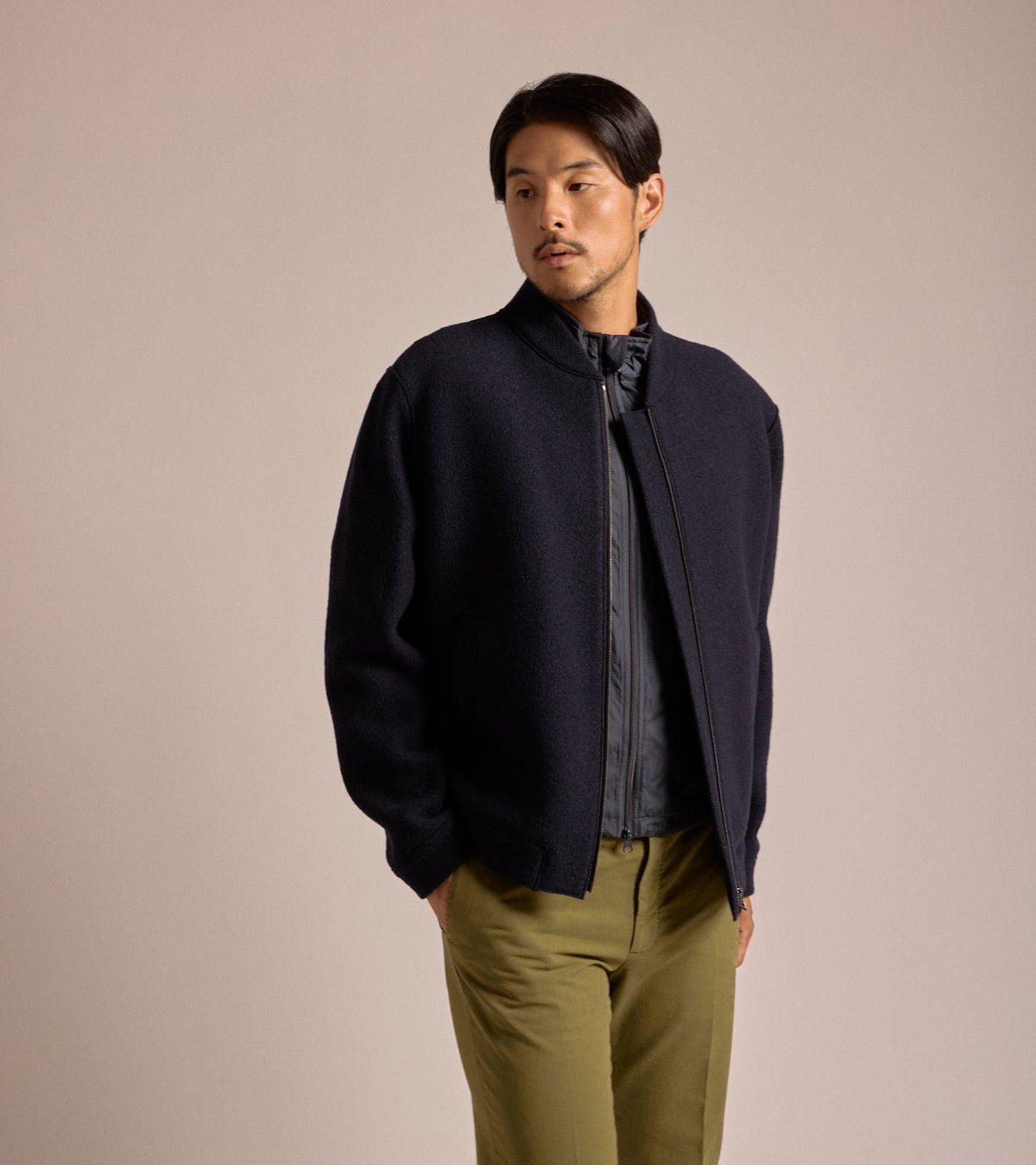 Model wearing teh Harris Wharf Boiled Wool Bomber Jacket in Navy.
